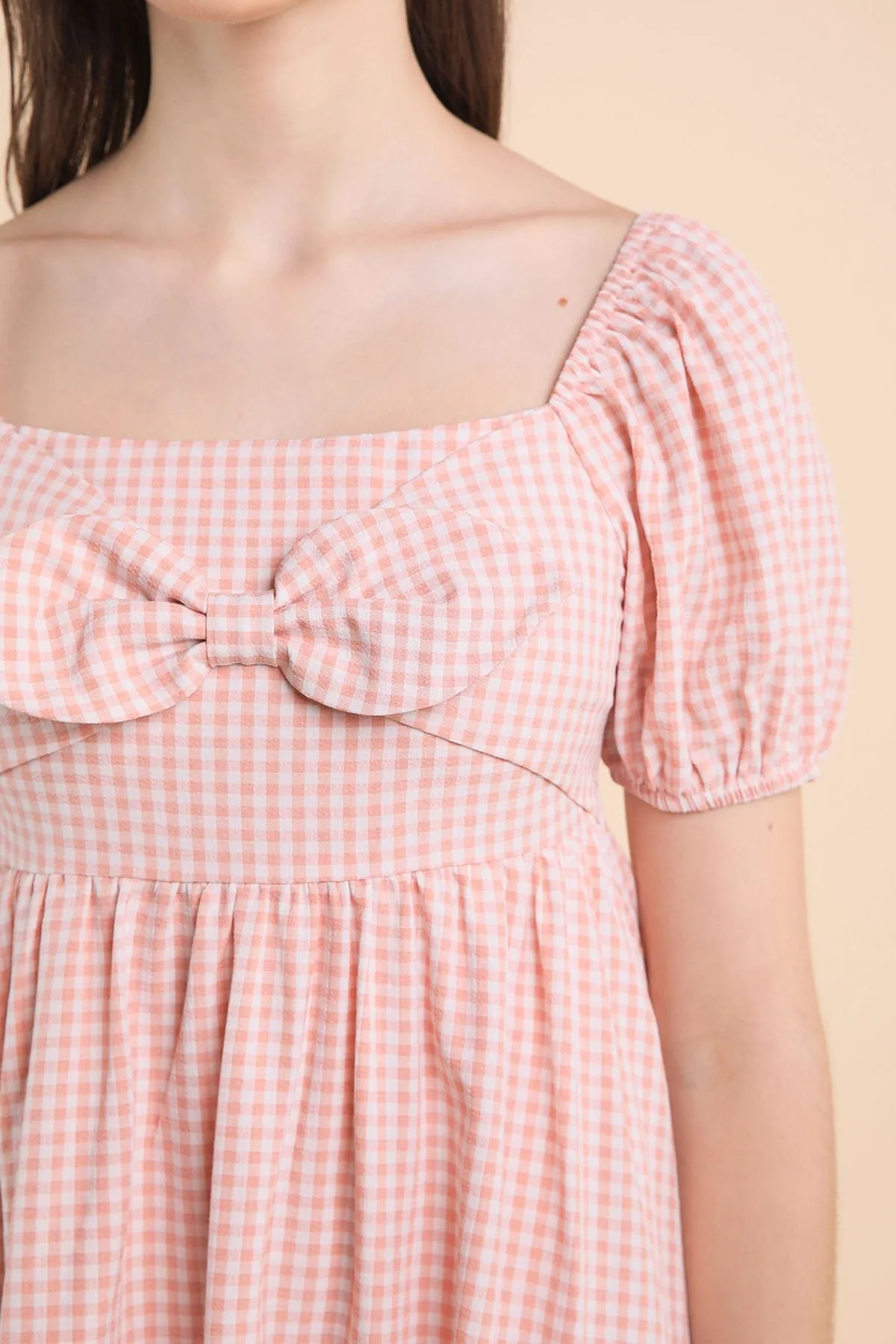 LOUISA BABYDOLL GINGHAM ROMPER DRESS IN PEACH PINK